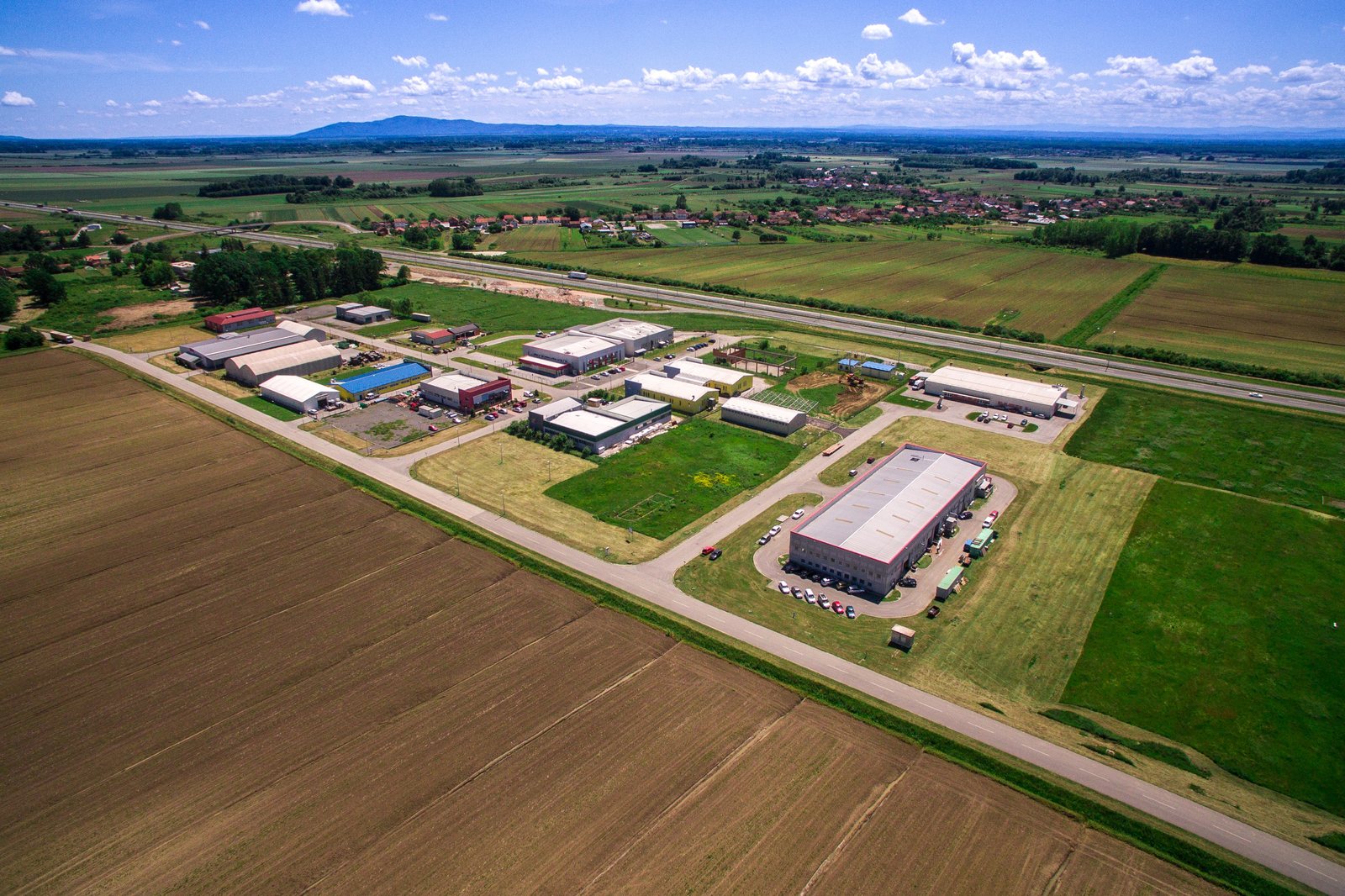 Aerial view of Industrial Park Nova Gradiška, with the Hladni Val building in the lower right, identifiable by its grey roof and red trim